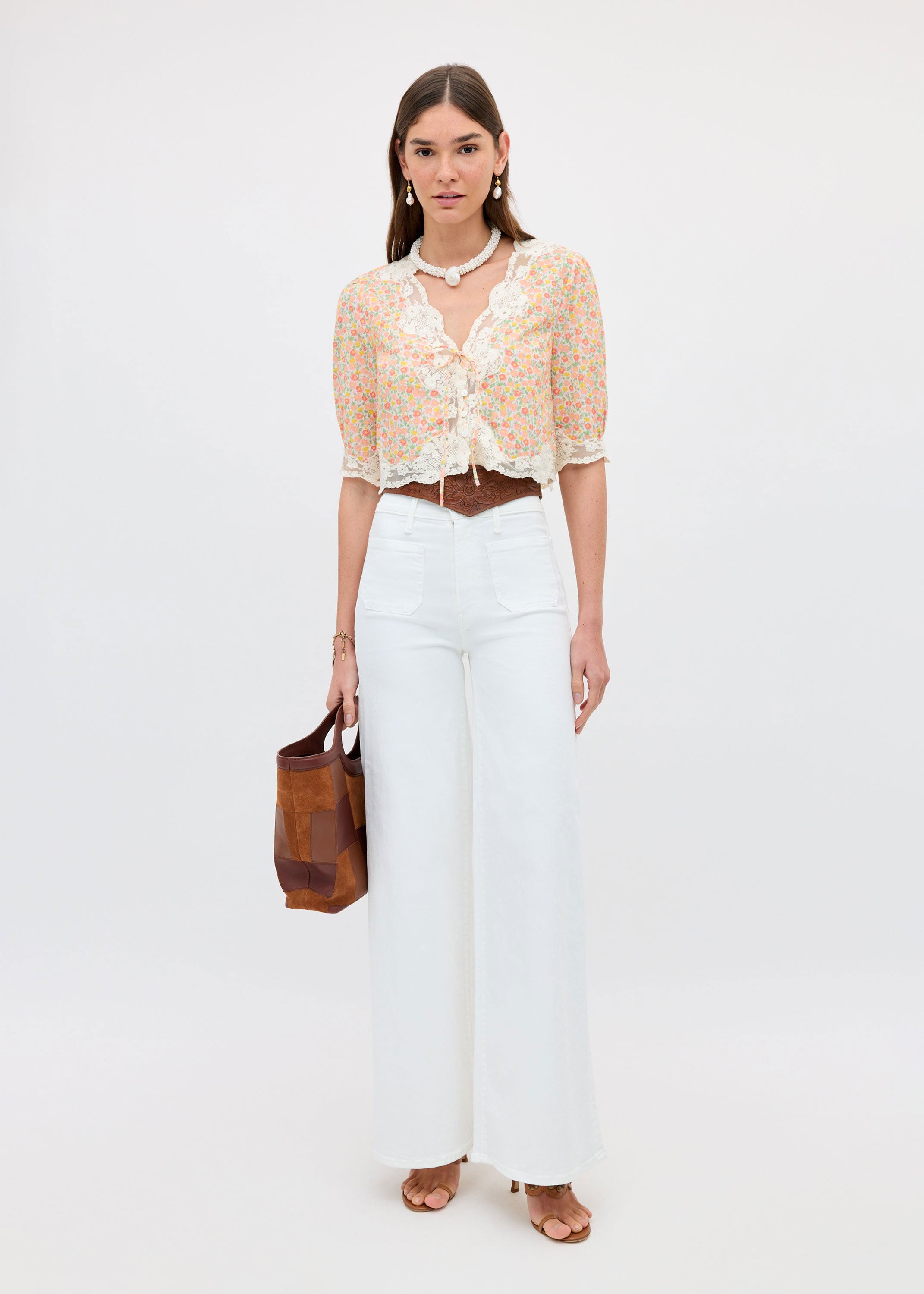 Rixo Full body styled with white wide-leg jeans and a tan suede tote