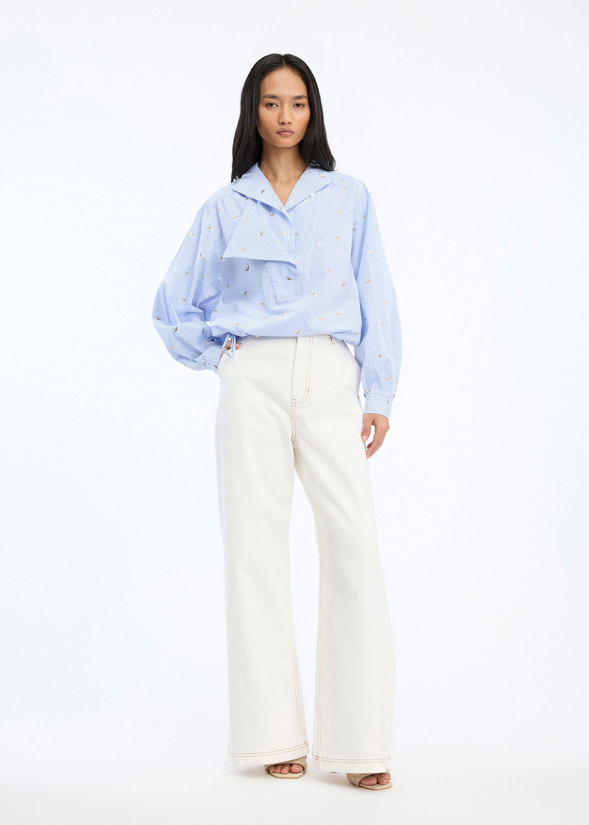 Munthe Front view styled with white trousers and heels