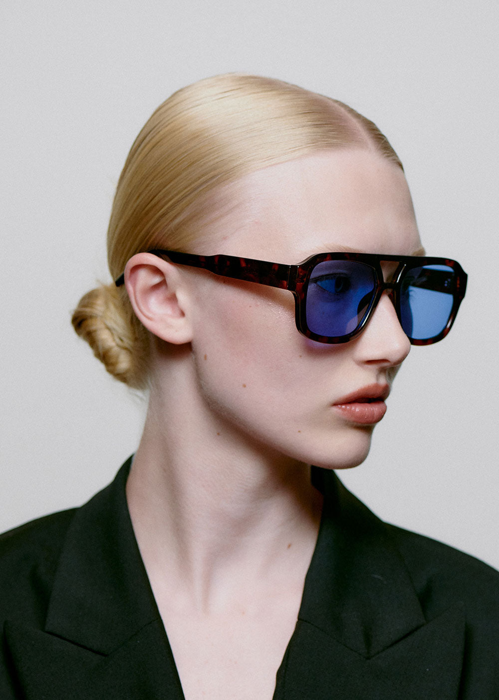 A. Kjaerbede Worn in profile by a model with the lenses on
