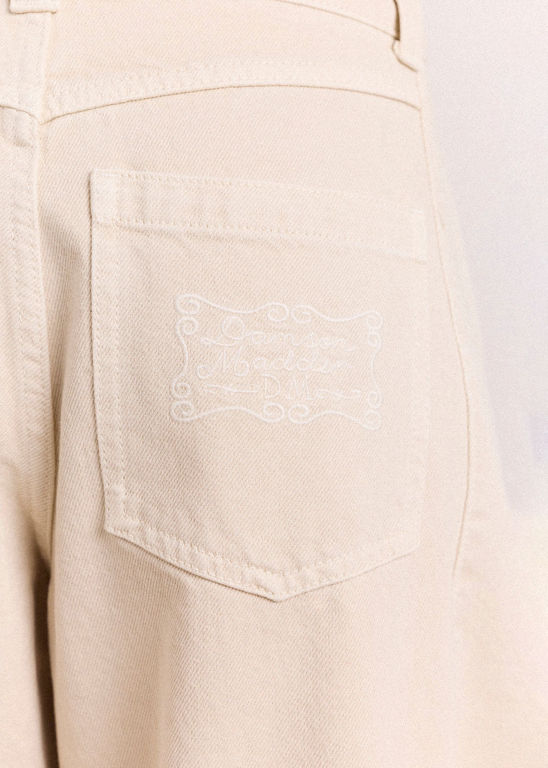 Damson Madder Tonal crest detail stitched onto the right back pocket