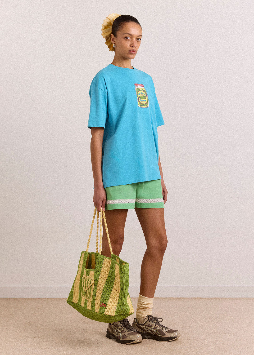 Damson Madder Full body styling with a blue tee and green shorts