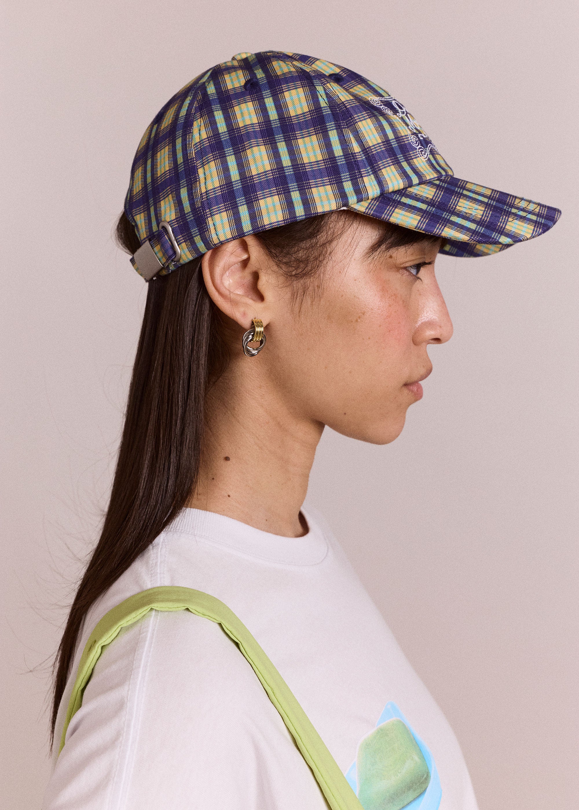Damson Madder Side view, blue tomboy check cap with adjustable strap