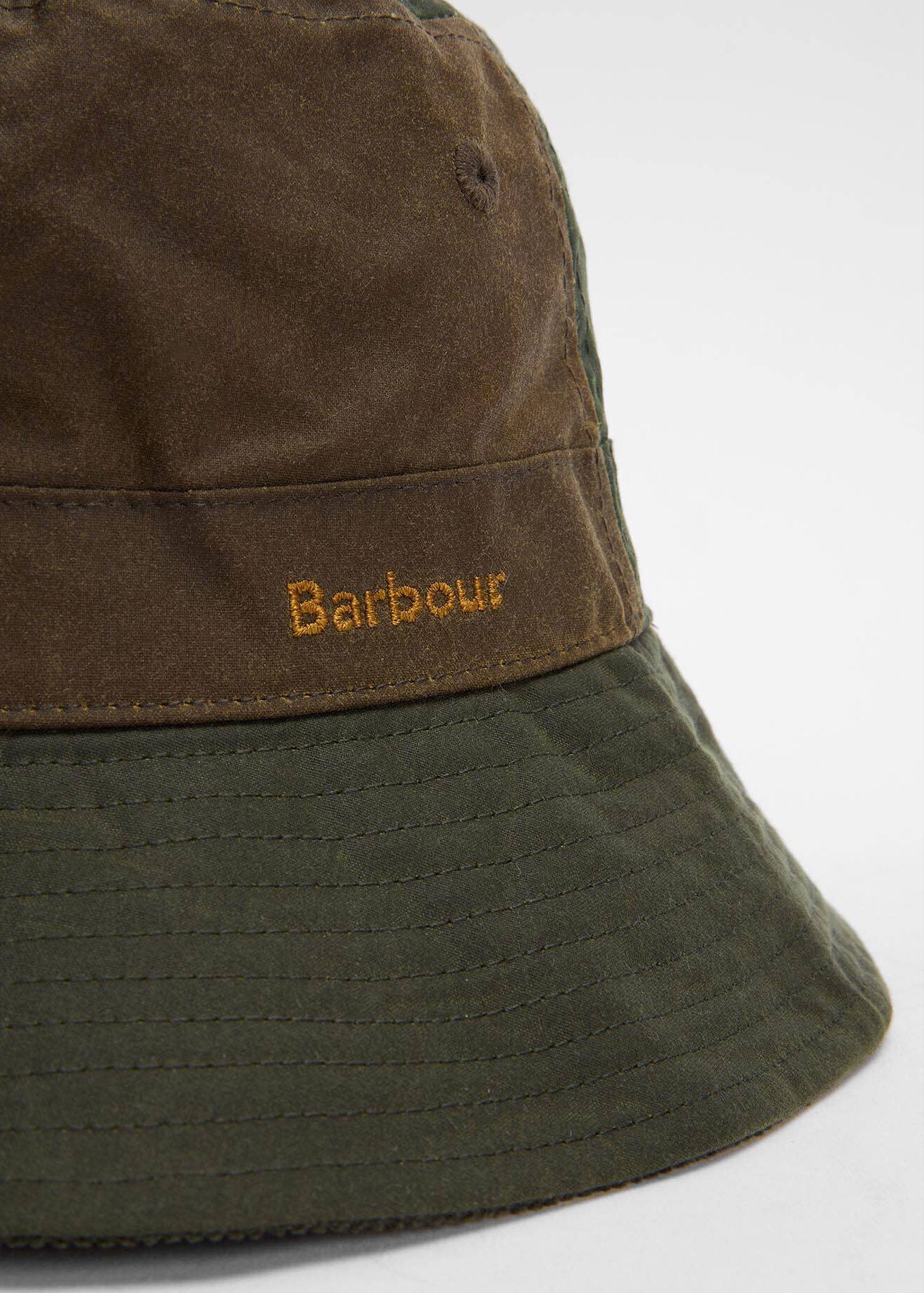 Barbour Close-up of the gold Barbour embroidery on the waxed crown band