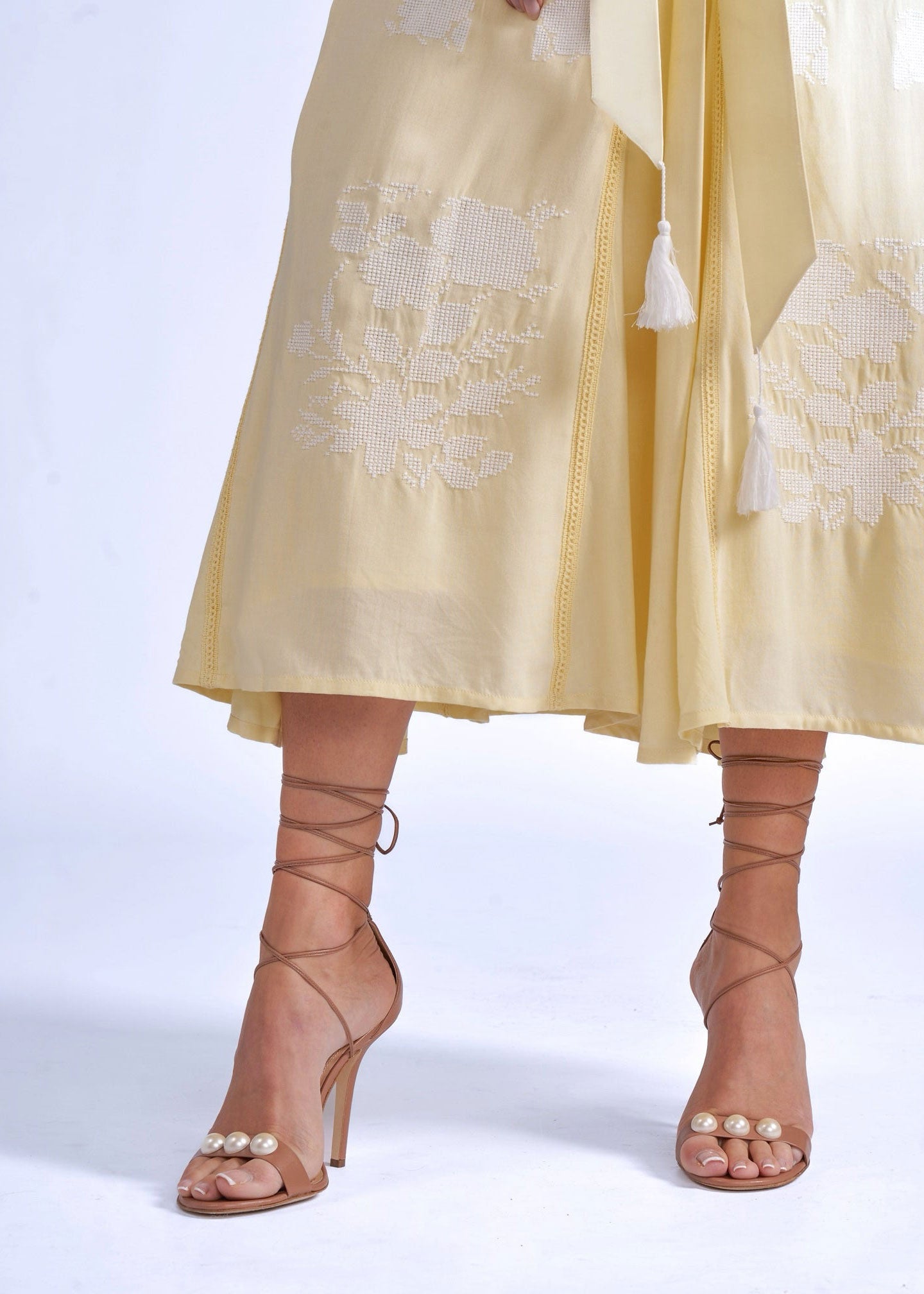 New Day Originals Waist detail, white cross-stitch floral motif beneath the sash belt