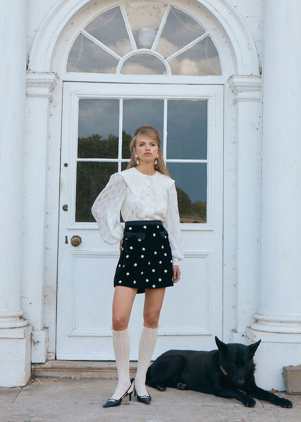 Queens of Archive Lower angle at the doorway, floral jacquard weave and cuffed balloon sleeves