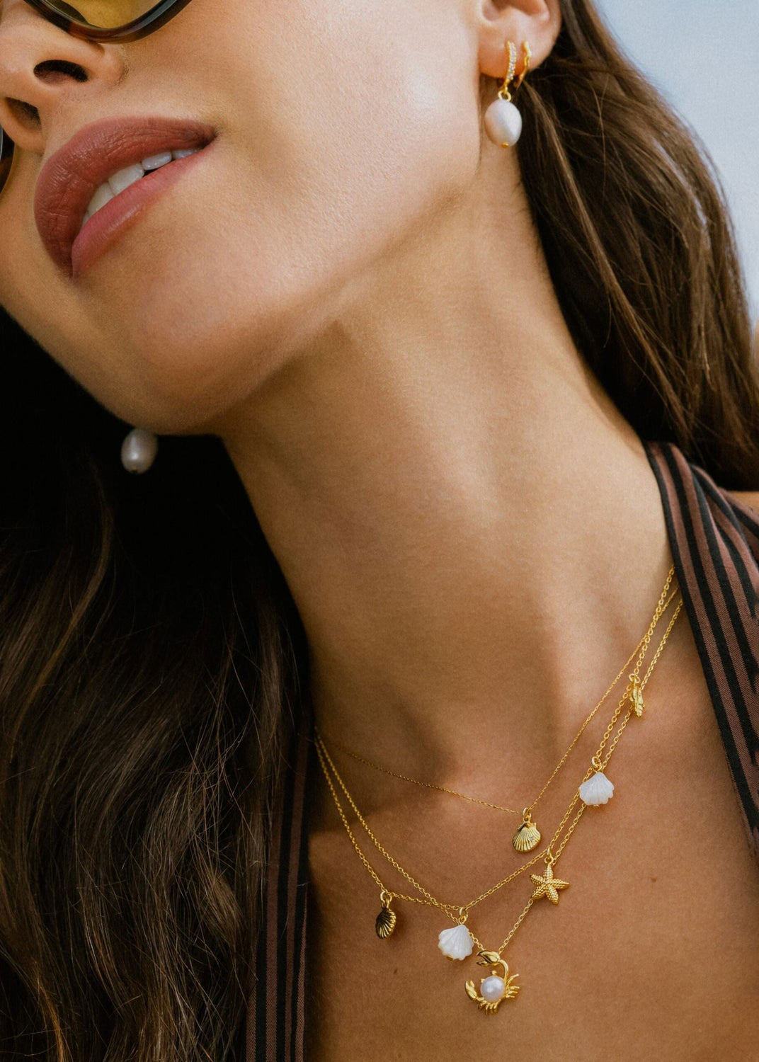 Orelia On-neck styling shot with the crab charm at the collarbone
