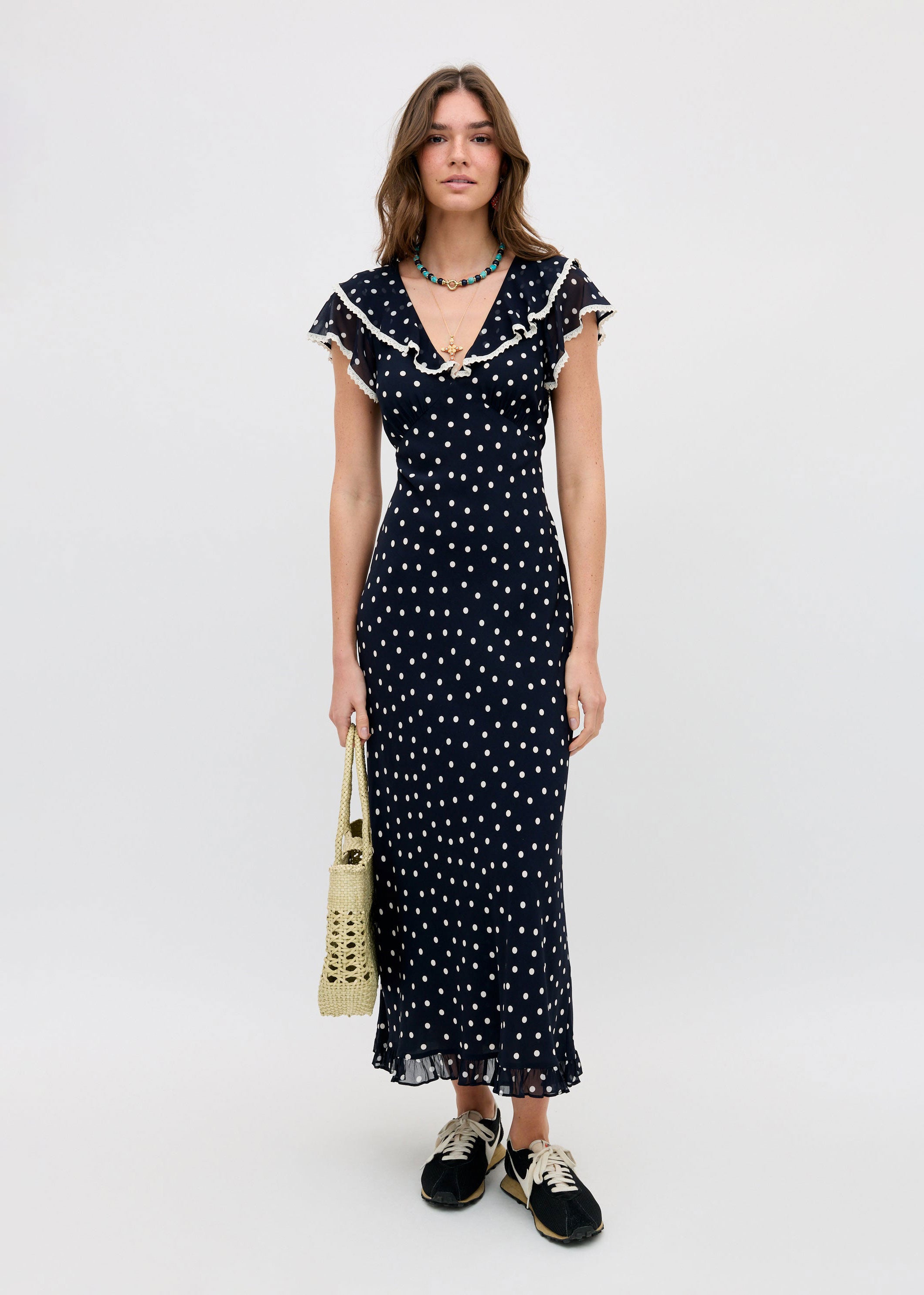Rixo Casual styling with a raffia tote and black trainers