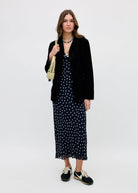 Layered under a black suede fringed blazer and turquoise bead necklace