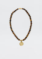 Rixo Ischia necklace with tiger's eye beads and engraved gold-plated pendant