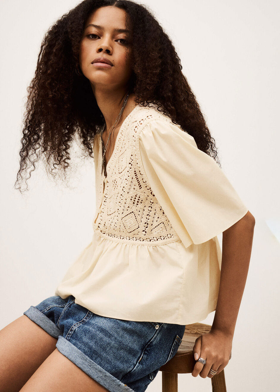 BA&SH Side view, flutter sleeve drape over the cropped V-neck silhouette