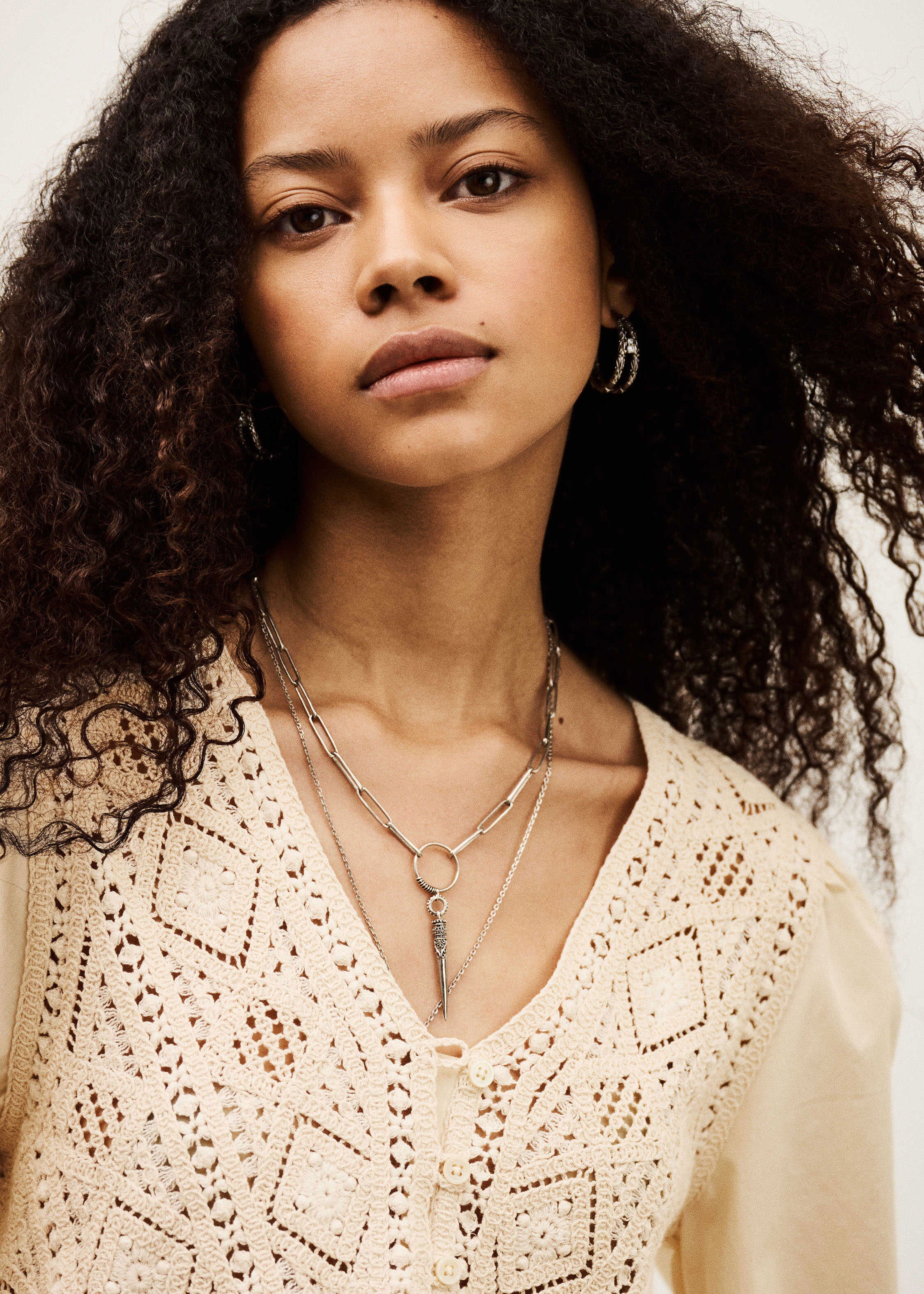BA&SH Close-up of the crochet yoke and front button placket with layered silver necklaces