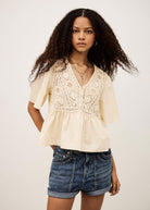 BA&SH Salvi blouse in ecru, crochet lace yoke with peplum hem and flutter sleeves