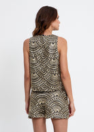 Three-quarter back view, gold fan and triangle embroidery across the rear panel