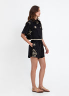 Side full-length styling with the matching black and gold Lefkada shirt