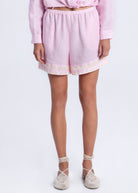 Front close-up, elasticated drawstring waist and embroidered hem detail