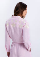 Back view, gold floral and fan embroidery across the shoulder yoke