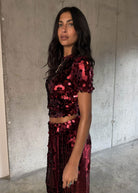 Three quarter turn with shimmering disc sequins and short sleeves