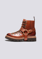Side profile with brass ring harness, woven leather strap and chunky lugged sole