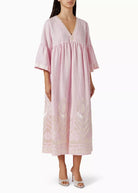 Full-length front view, empire bodice and three-quarter bell sleeves on pink linen