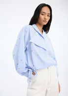 Munthe Beliciama blouse in light blue stripe, draped neckline with bird motifs