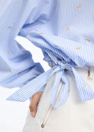 Sleeve detail with the tie cuff and balloon volume