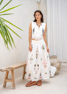 Worn styled in a sunlit room beside a wooden bench