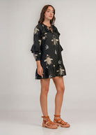 Side view showing ruffle cuffs and tiered hem