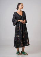 Side view of the flowing embroidered midi dress
