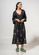 Front view with multicoloured hem embroidery