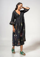 Relaxed pose showing the gathered empire waist