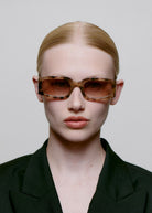 Worn front-on by a model with the lenses on