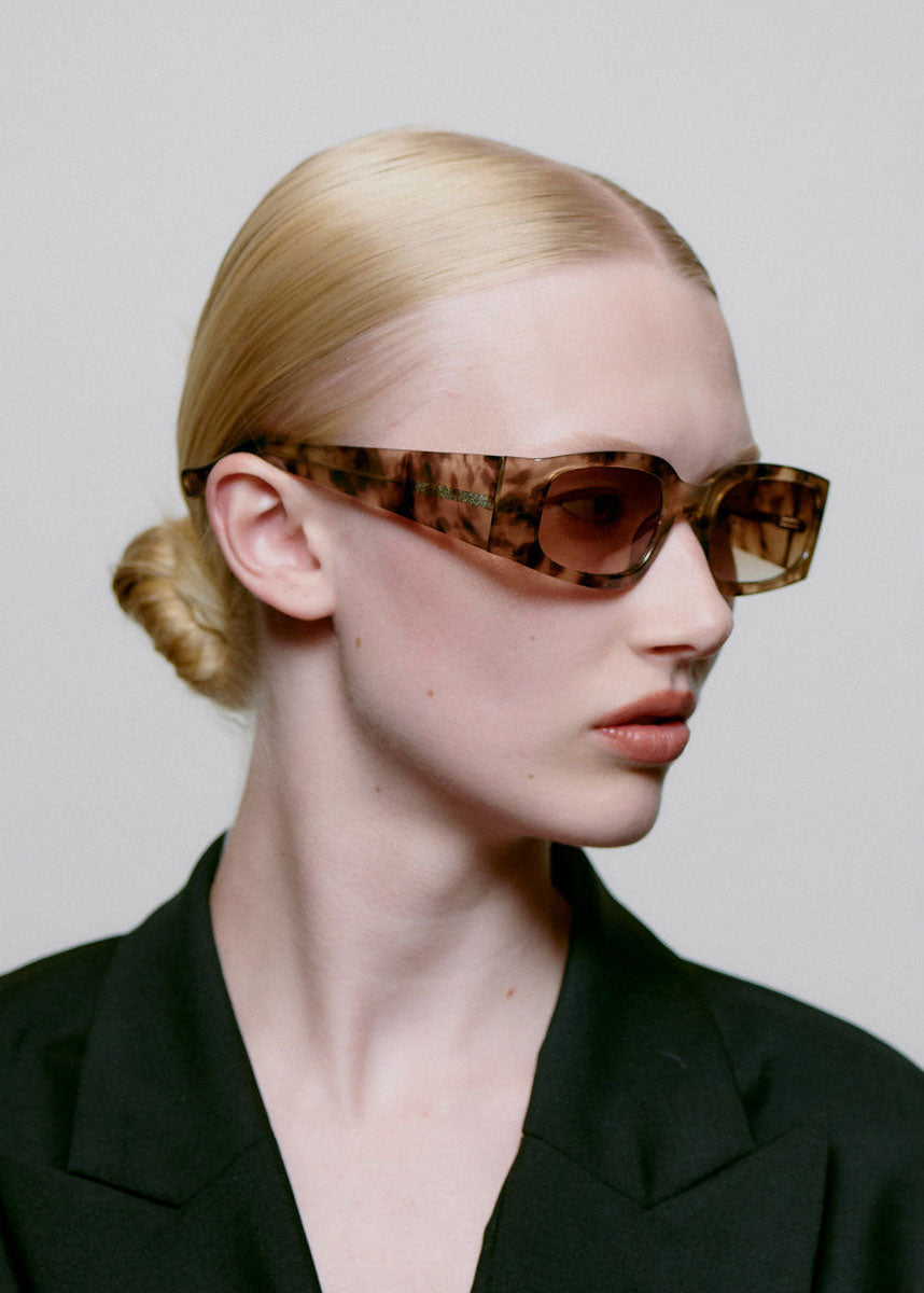 A. Kjaerbede Worn in profile by a model with the lenses on