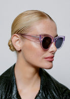 Worn in profile by a model with the lenses on