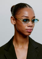 Worn in profile by a model with the lenses on