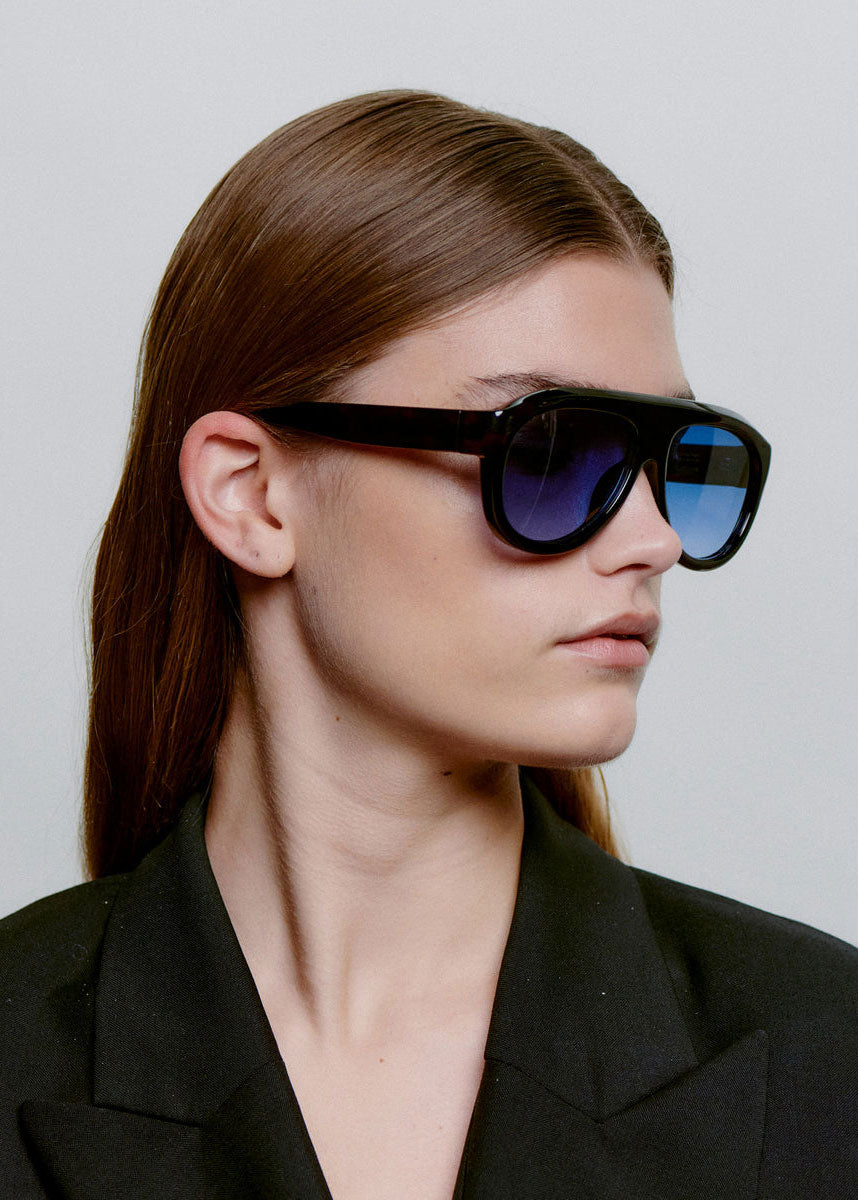 A. Kjaerbede Worn in profile by a model with the lenses on
