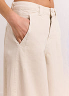 Cropped front hip view, hand resting in deep slant pocket