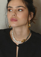 On-model editorial shot showing the necklace worn