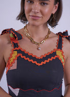 Sweetheart bodice close-up, layered ric-rac trim framing the neckline