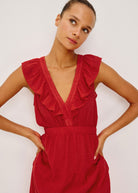 Close-up of the ruffled V-neckline and shirred empire bodice