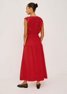 Back view, ruffle shoulders and smocked empire waist