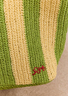 Corner close-up, ribbed base and embroidered logo signature