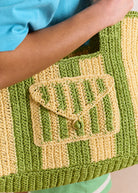 Close-up of the crochet flap pocket with single button closure
