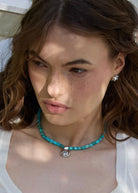 On-model styling shot at the throat with a simple neckline