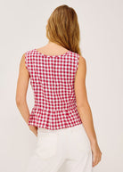 Back view, scoop neckline and gathered peplum hem