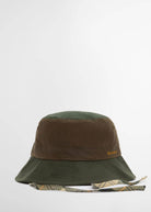 Tartan chin ties hanging loose beneath the brim, classic Barbour check