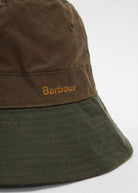Close-up of the gold Barbour embroidery on the waxed crown band