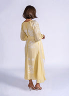 Side three-quarter view, soft draping through the bias-cut skirt panels