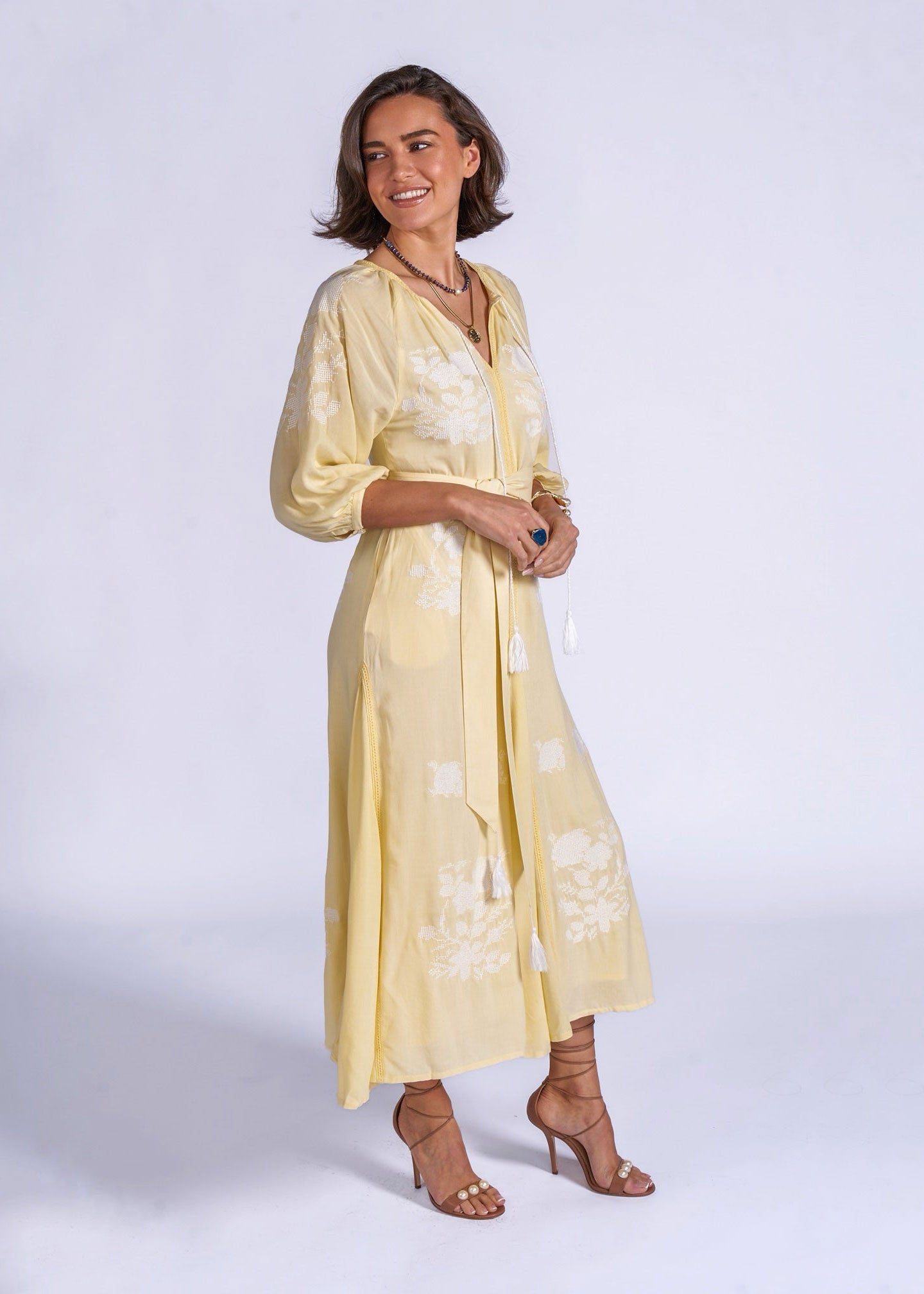 New Day Originals Back view, gathered yoke and white floral embroidery panels along the skirt