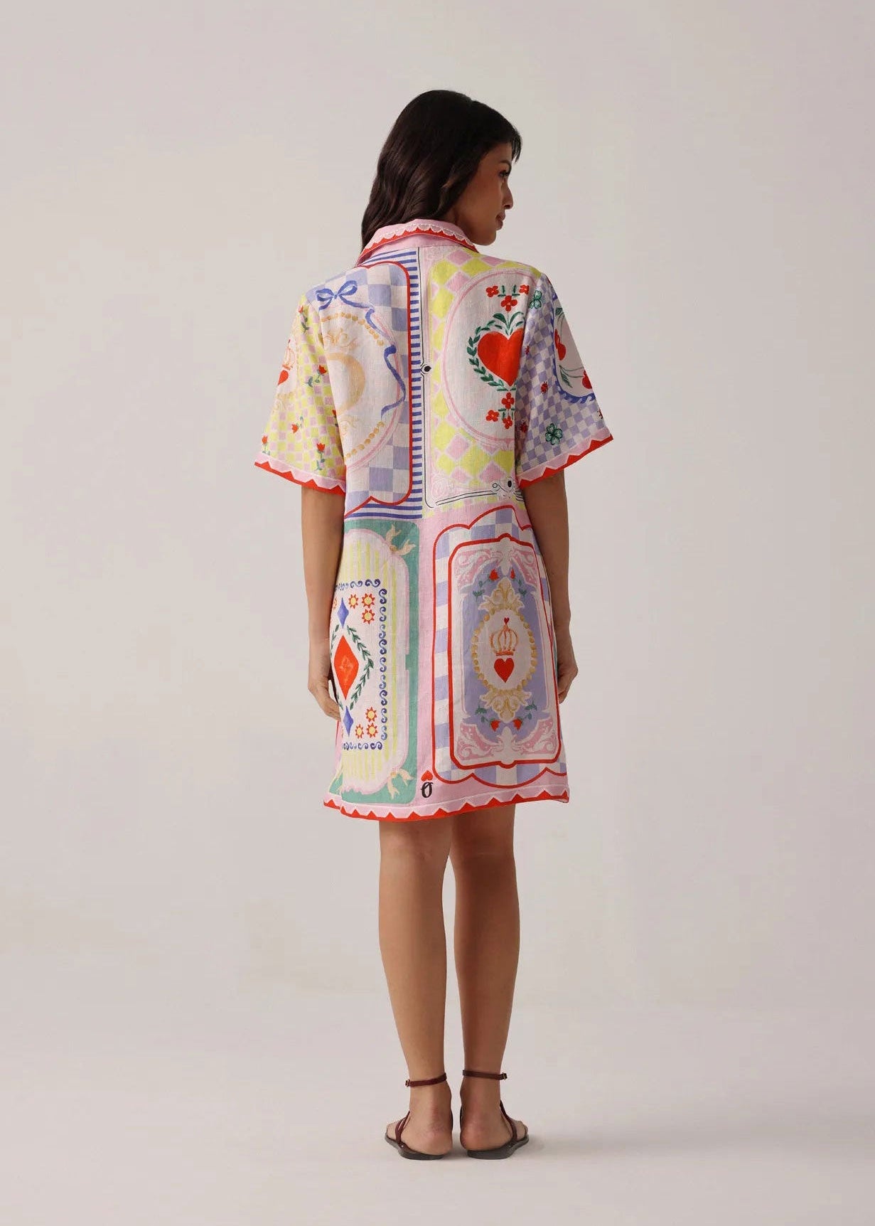 NOIB Back view with placement print and scalloped red trim at the hem