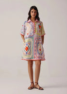 Front studio view showing playing-card panel print and red scalloped hem